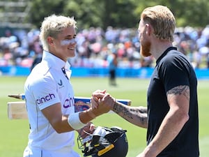 England’s Jacob Bethell, left, is congratulated by his captain Ben Stokes