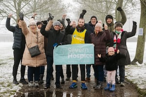 Tim Stevens was greeted by friends and family after finishing his marathon challenge. Picture: Jamie Ricketts