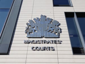 A sign for a magistrates' court