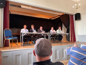 Mr Lewis - far left - at a pre-election hustings in Montgomery Town Hall last year.