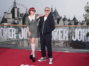 Lady Gaga and Joaquin Phoenix in front of the London skyline