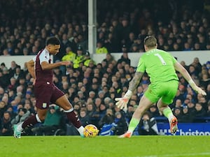 Ollie Watkins, left, scores the winning goal for Villa