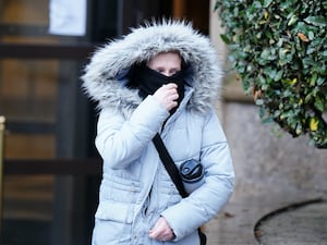 Marianne Gallagher leaving court with her face covered