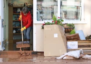 People cleaning up after the flooding in Tenbury Wells. 