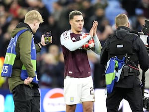 Morgan Rogers holds the match ball as he claps the Villa fans