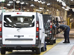 A man inspects a van at the Vauxhall plant in Luton