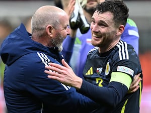 Andy Robertson (right) celebrates his late winner with Steve Clarke