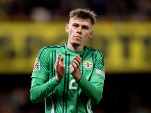 Conor Bradley applauds the Northern Ireland fans