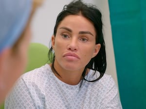 Katie Price wearing a hospital gown