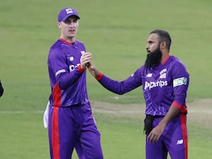 Adil Rashid and Harry Brook embrace