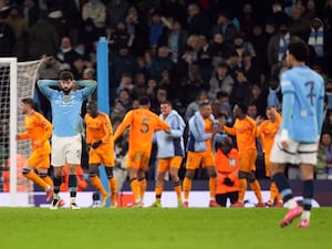 Real Madrid players celebrate a late win at Manchester City