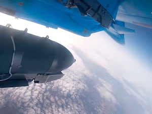 An Su-34 bomber of the Russian air force drops bombs on Ukrainian positions