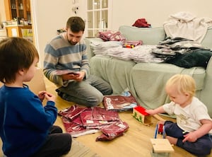 Paul Watson organising donated football shirts with family 