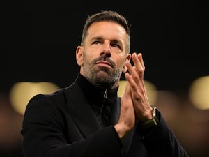 Manchester United interim manager Ruud van Nistelrooy applauds the fan after their win over PAOK in the Europa League