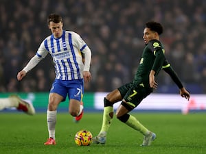 Solly March (left) and Kevin Schade battle for the ball