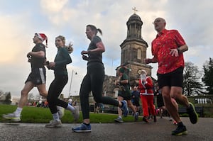 Shrewsbury runners race past St Chad's Church