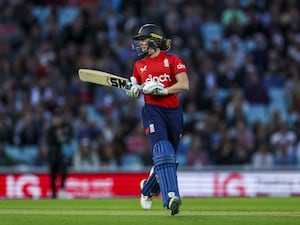 Heather Knight walking with the bat