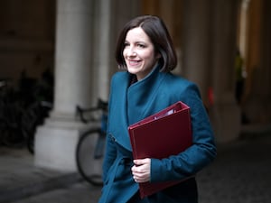 Bridget Phillipson holding a red folder arriving at Downing Street