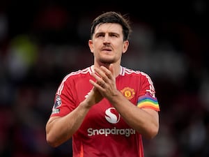 Harry Maguire applauds Manchester United's fans after their match against Everton