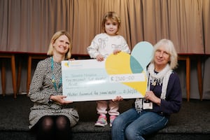 Nicky Green of Severn Hospice, 4 year old Everley O'Boyle, and Navy Club Committee Member, Jude Paton