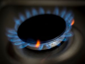 A lit gas ring on a cooker