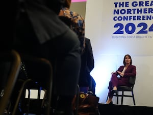 Rachel Reeves sitting on a chair answering questions