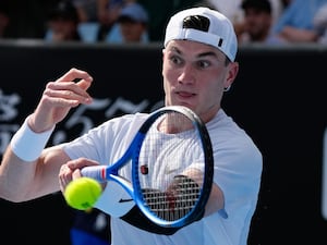 Jack Draper plays a forehand against Mariano Navone