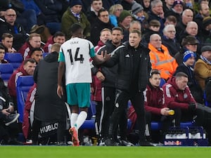 Newcastle United’s Alexander Isak high five’s manager Eddie Howe