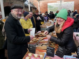 Tracey Dugan from Dugan's Patisserie serves Jeremy Atkinson at a previous food festival