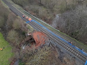 Network Rail engineers inspecting the damage.