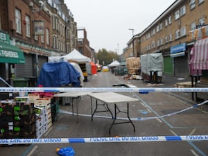 Police at the scene in East Street, Walworth, south London, following a fatal stabbing