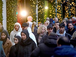 People shopping passing Selfridges in Oxford Street