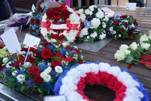 Wreaths are laid during a memorial service 