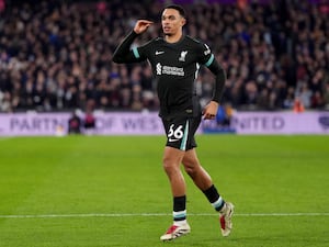 Liverpool’s Trent Alexander-Arnold puts his hand to his ear in celebration