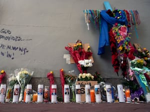 Candles and flowers left in tribute