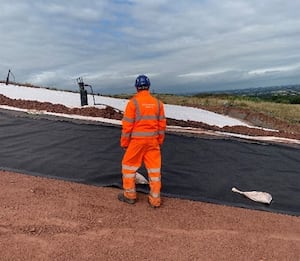 An Environment Agency Officer Inspecting The Progress Of The Capping Works At Redhill. Picture Environment Agency