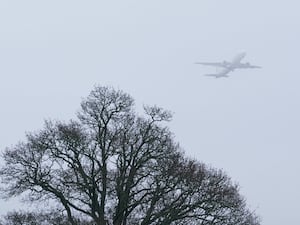 A plane takes off in foggy conditions from London Gatwick airport in Crawley, West Sussex