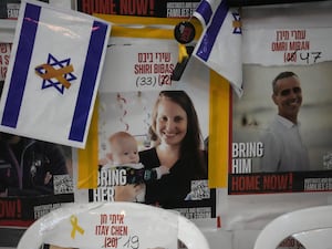 A poster in Jerusalem shows Shiri Bibas, who was kidnapped to Gaza with her husband and two young sons