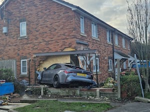 The BMW that ploughed into a Telford home. 