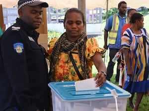 A woman casts her ballot during Vanuatu’s snap election