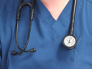 Close-up of a doctor's scrubs and stethoscope