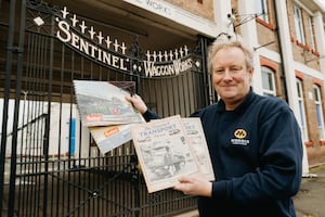 Ed Goddard in front of the newly restored gates. Picture: Jamie Ricketts