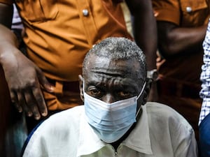 Kizza Besigye in a face mask in court