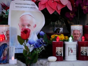 Candles and a picture of the Pope