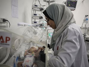 Baby in an incubator being treated