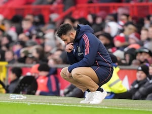 Manchester United manager Ruben Amorim appears dejected on the touchline