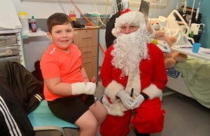 Santa, with Jayden Evans, 6, from Wellington