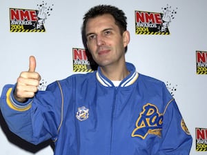 Tim Westwood making a thumbs up gesture with his right hand