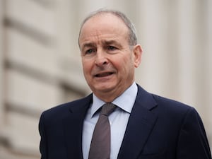 A close-up of Micheal Martin in a suit and tie