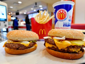 A McDonald’s Quarter Pounder, left, and Double Quarter Pound burger with fries and drink in a McDonald's restaurant